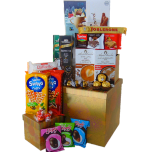 Christmas Gourmet Food Gift Basket Tower. Gold Leaves printed gift boxes filled with gourmet food. This Christmas gift basket tower is the best gift to send a family or a group of people to open and enjoy during the holidays. Gold leaves gift boxes two sizes 10 inch and 5 inch both boxes are filled with snacks and sweets. A hug amount of gourmet food siting inside the two boxes to be enjoyed for days during the holiday season. Gift Basket boxes will be placed on top of each other with clear cello wrap, ribbon, and a gift tag message.